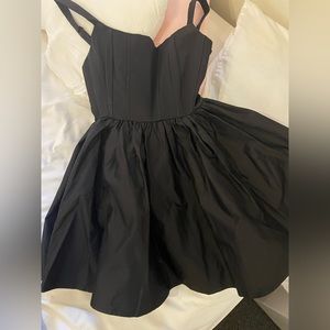 Black skater dress, side zipper. Size small, with adjustable straps. Brand new.